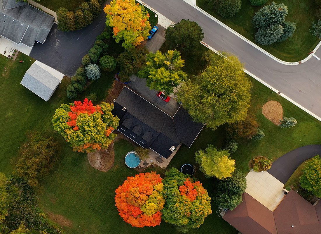Ashland, OH - Aerial View of American Suburban Neighborhood and a Residential Single Family Home in the Fall